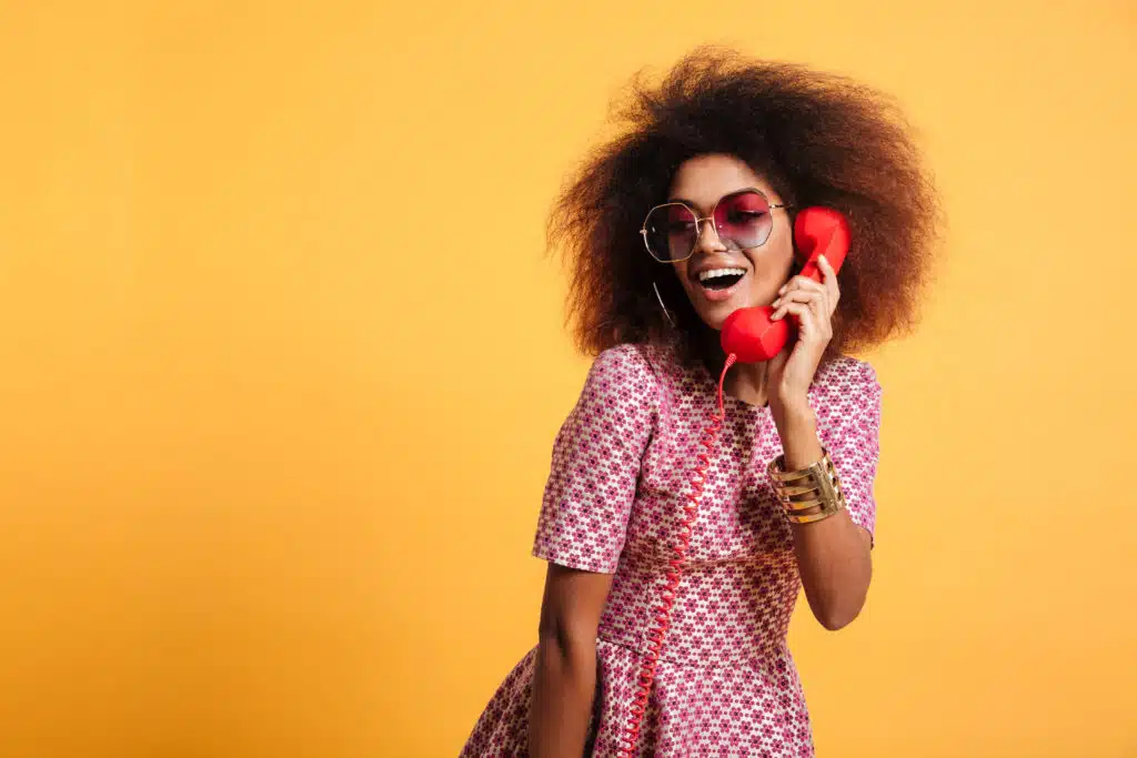 Smiling guest talking into audio guestbook phone